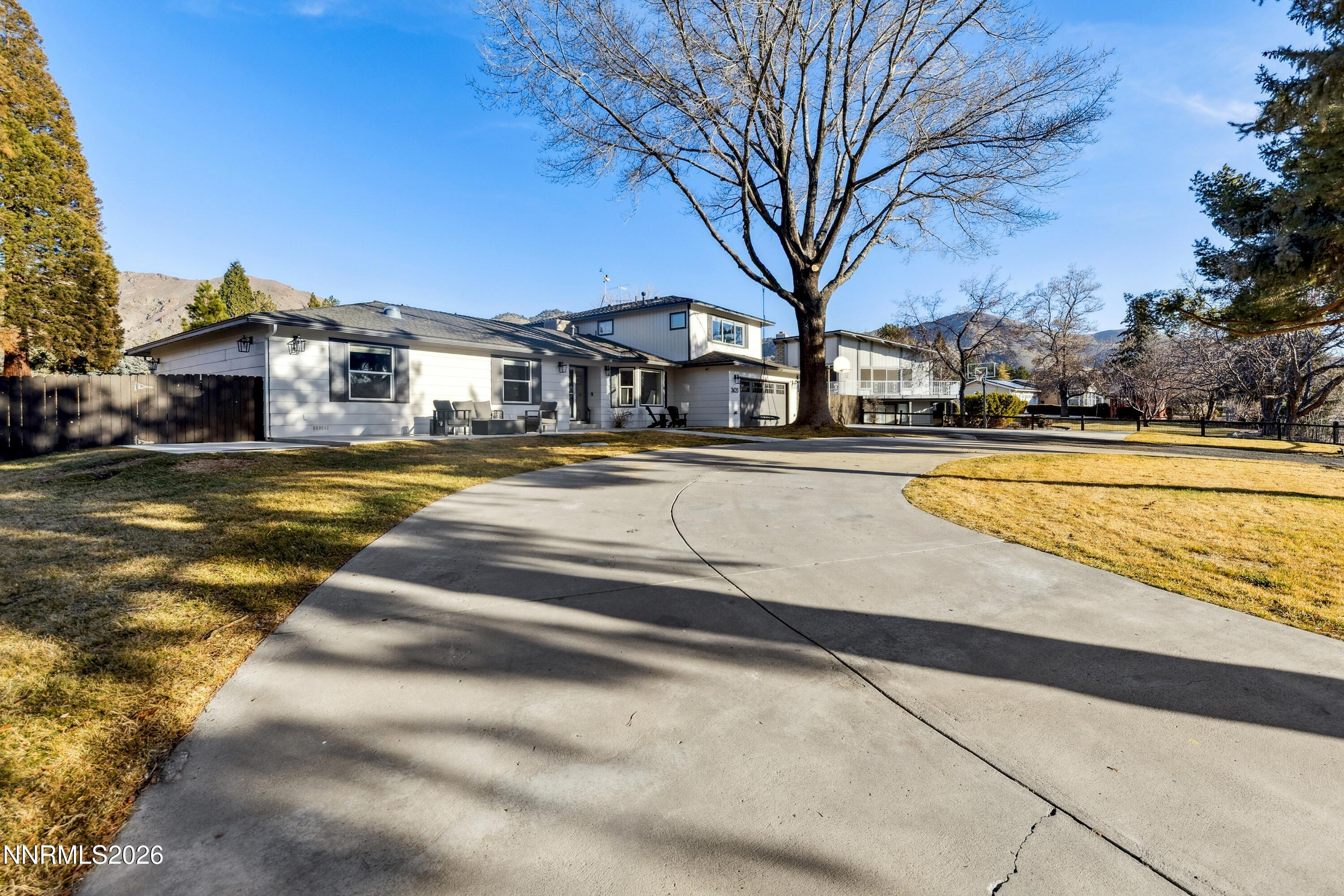 3620 East Hidden Valley Drive Reno, NV 89502 - Photo 11 of 67 a view of a swimming pool in front of residential houses