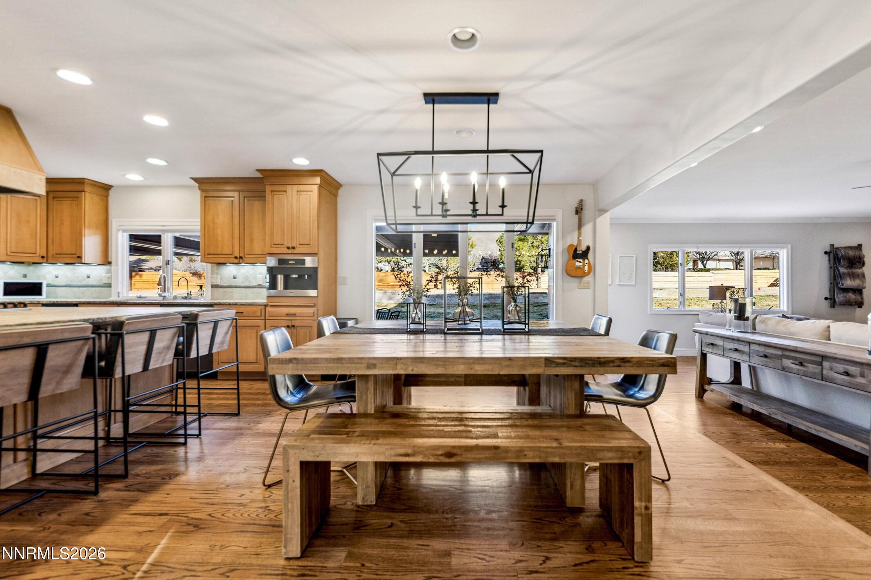 3620 East Hidden Valley Drive Reno, NV 89502 - Photo 21 of 67 a view of a kitchen with kitchen island stainless steel appliances wooden floor dining table and chair