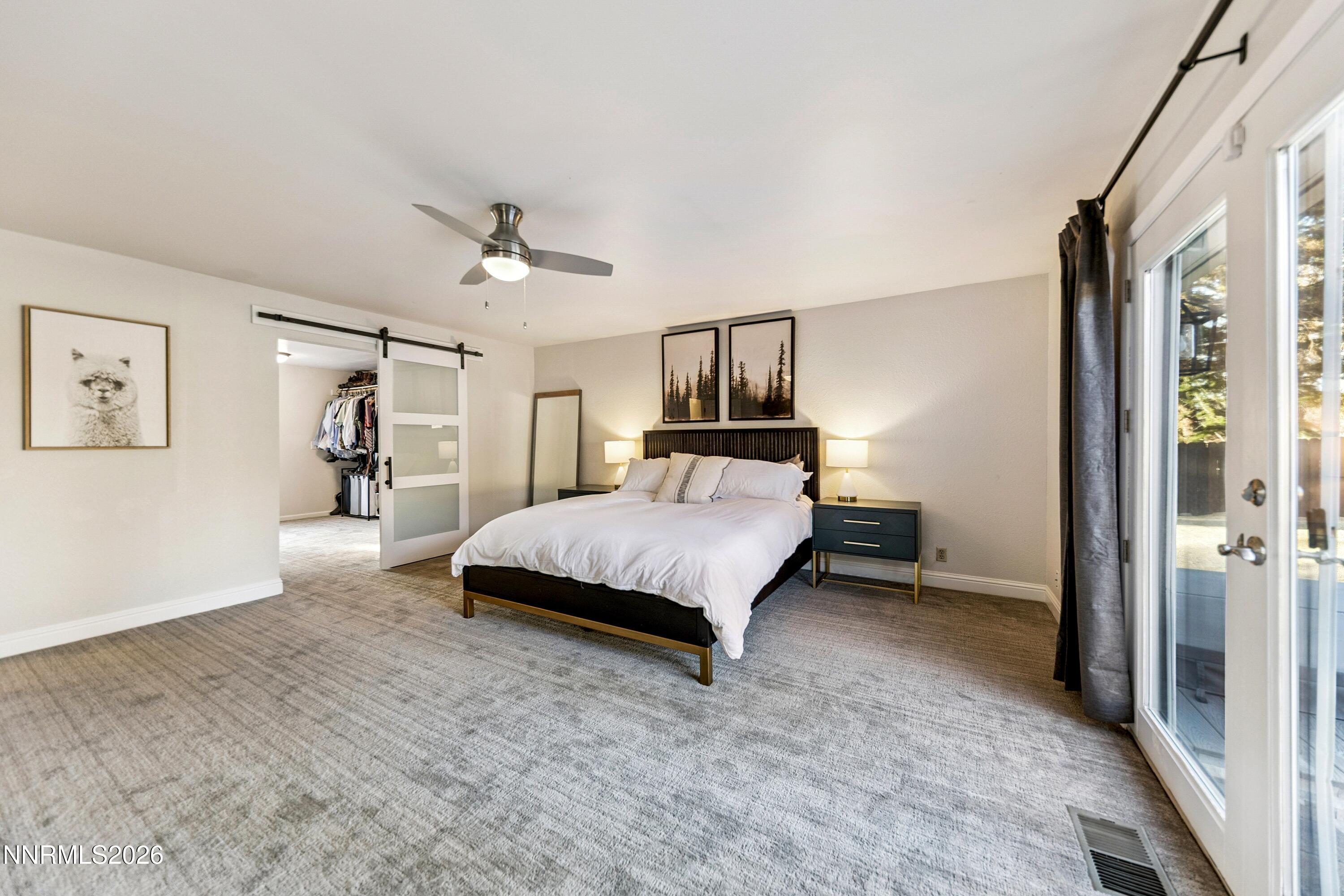 3620 East Hidden Valley Drive Reno, NV 89502 - Photo 32 of 67 a spacious bedroom with a bed and a walk in closet