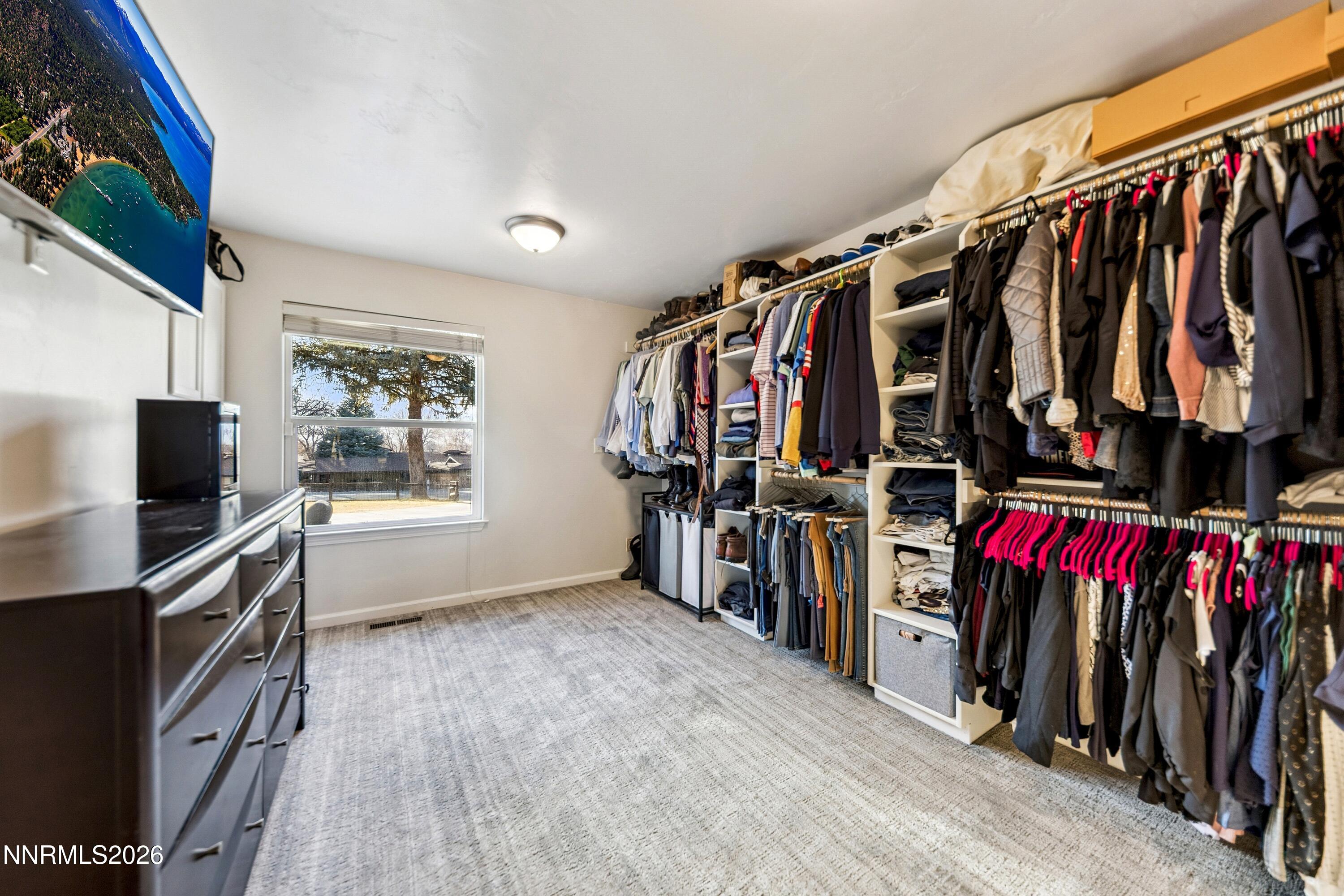 3620 East Hidden Valley Drive Reno, NV 89502 - Photo 33 of 67 a view of walk in closet with clothes and shoes
