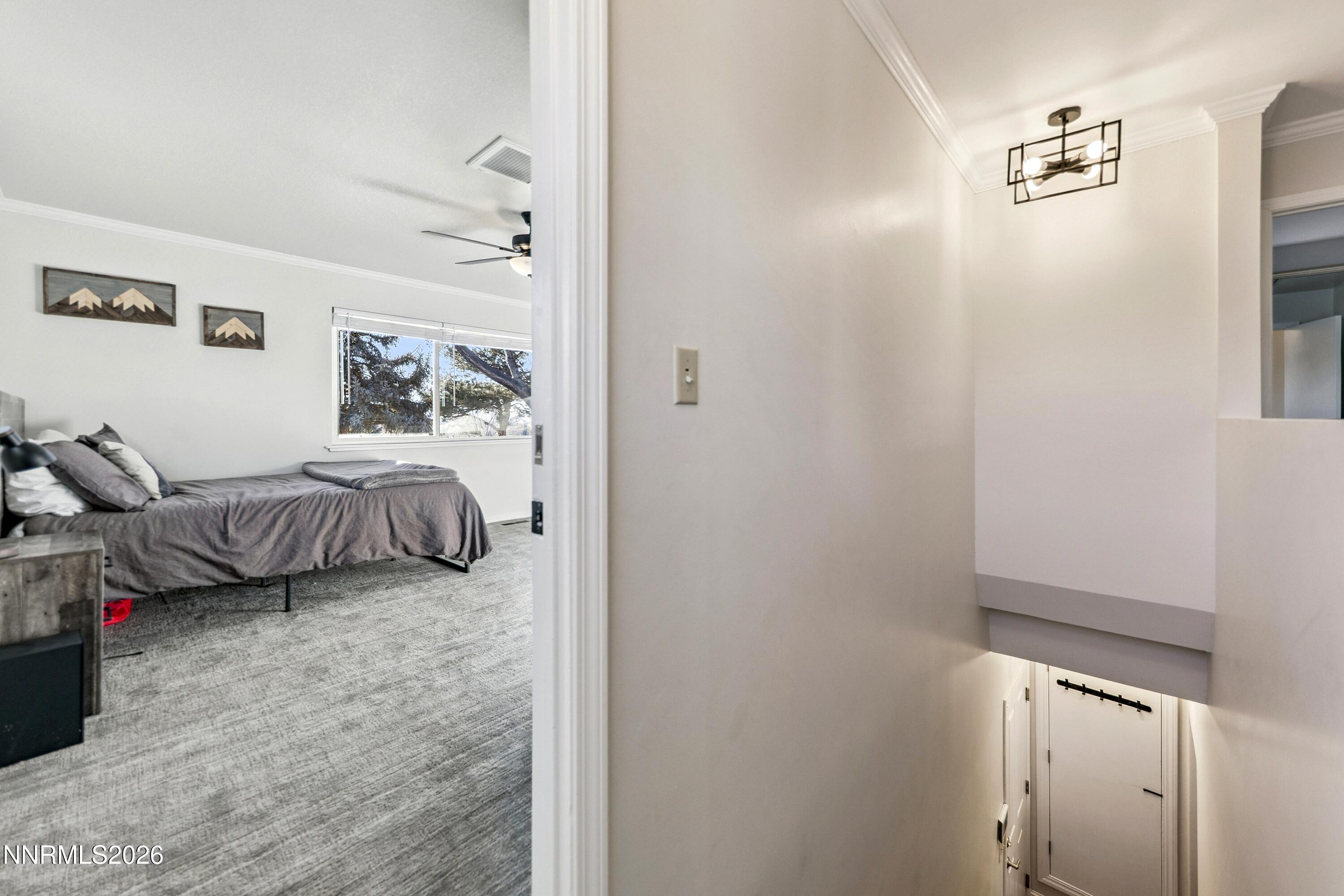 3620 East Hidden Valley Drive Reno, NV 89502 - Photo 37 of 67 a bedroom with a bed and a window