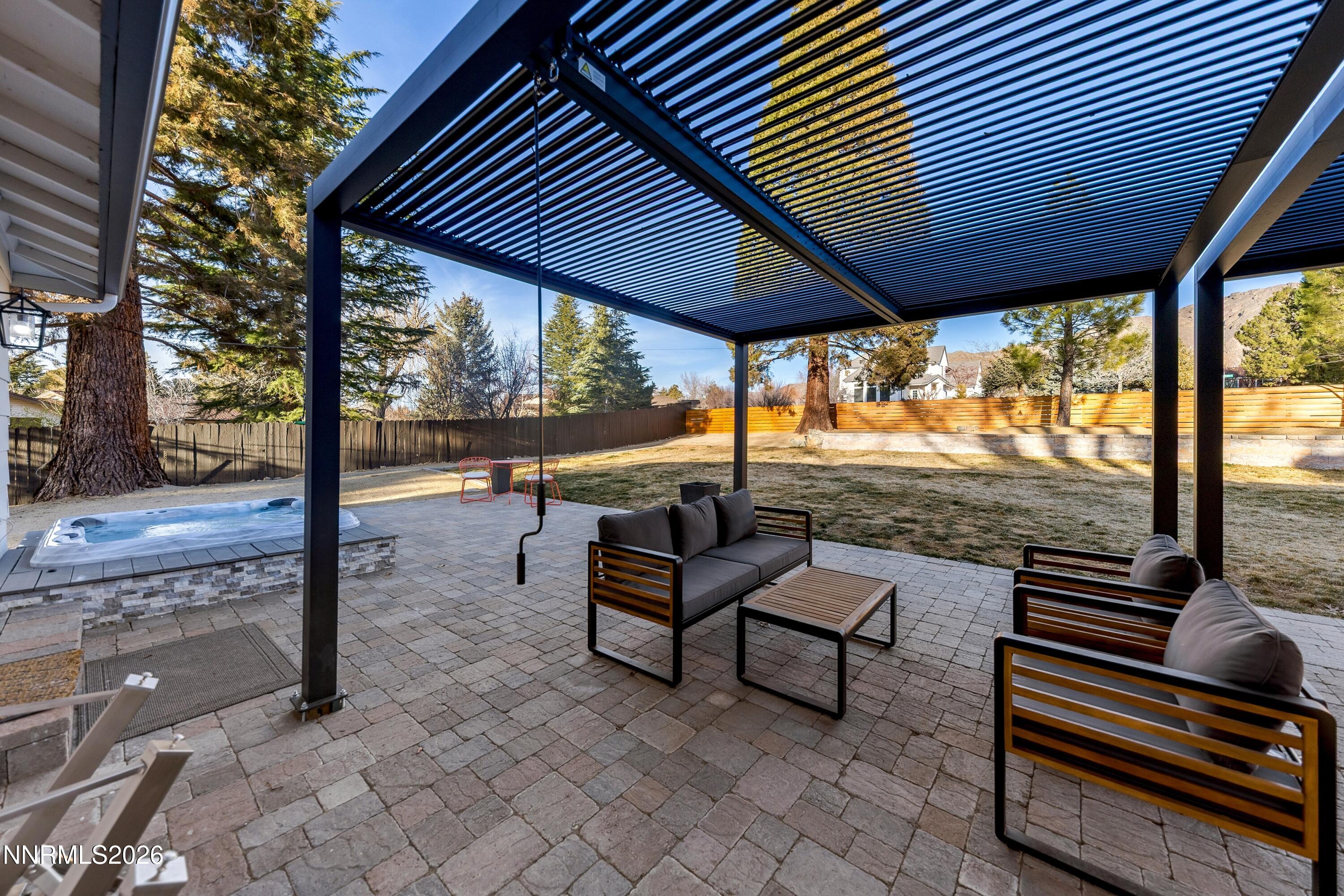 3620 East Hidden Valley Drive Reno, NV 89502 - Photo 51 of 67 a backyard of a house with wooden floor and outdoor seating