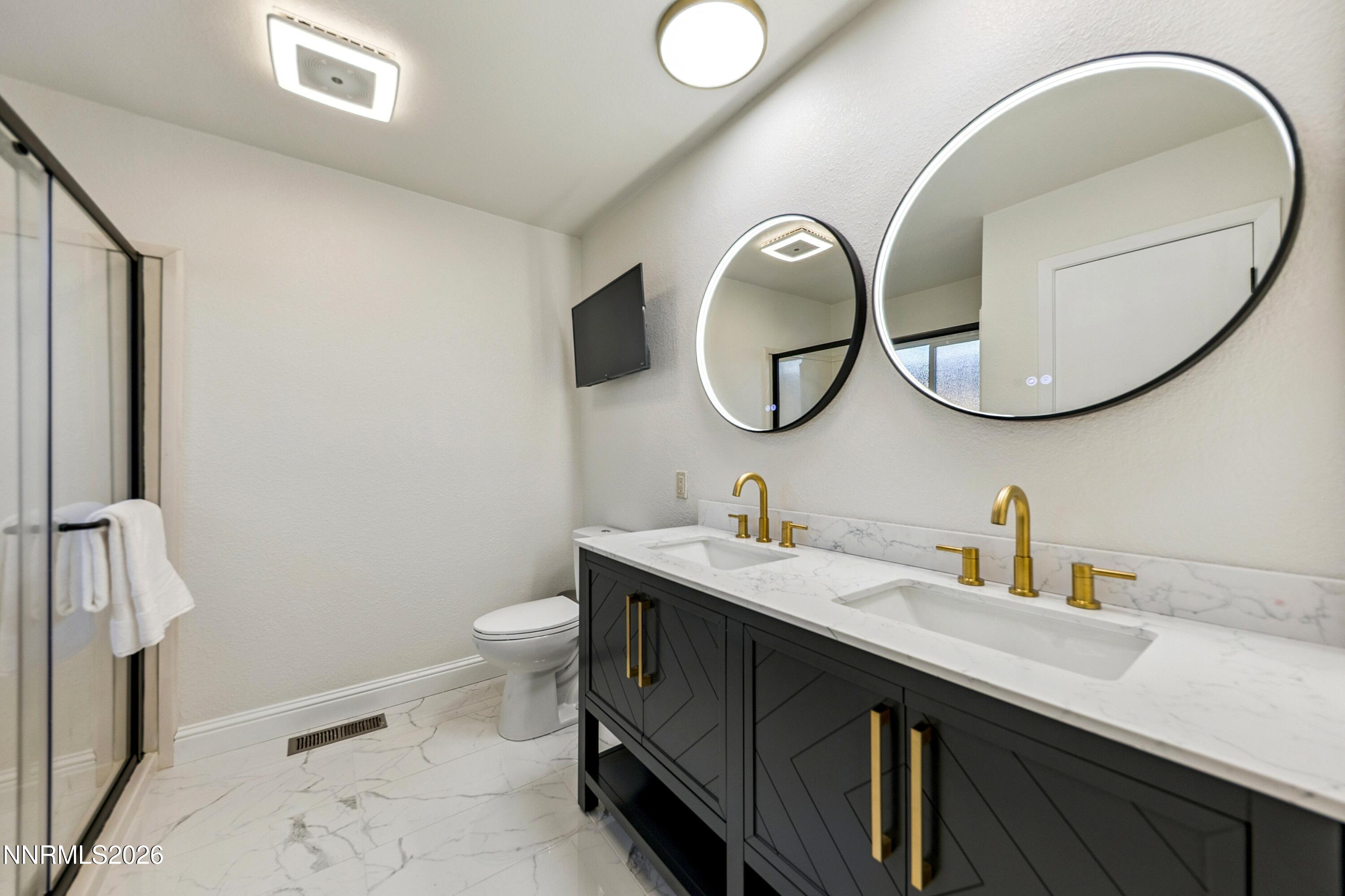 3620 East Hidden Valley Drive Reno, NV 89502 - Photo 6 of 67 a bathroom with a sink and a mirror