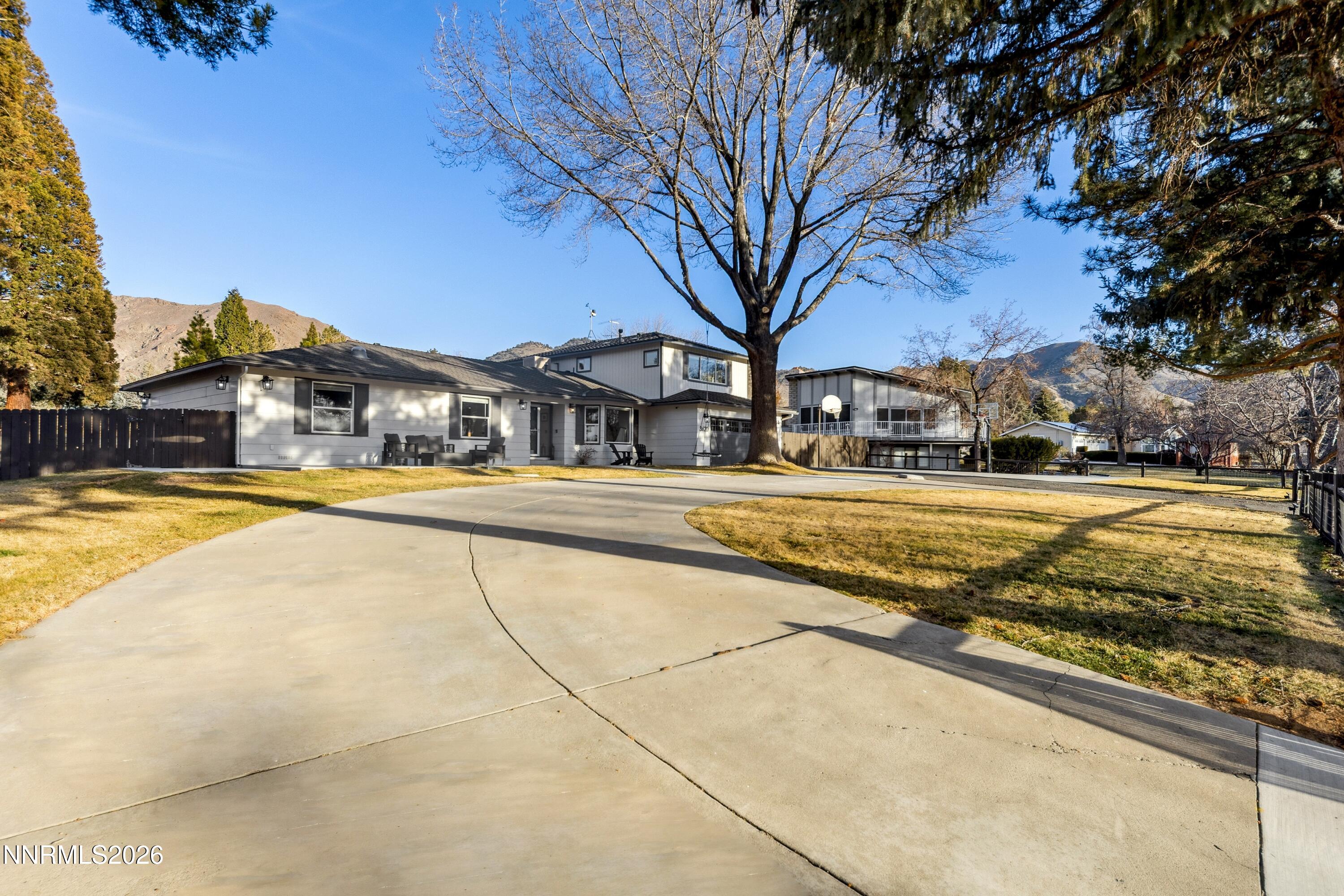 3620 East Hidden Valley Drive Reno, NV 89502 - Photo 63 of 67 a view of swimming pool with outdoor seating and house in the background