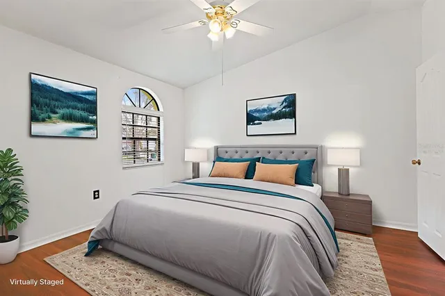 an empty room with a window and wooden floor