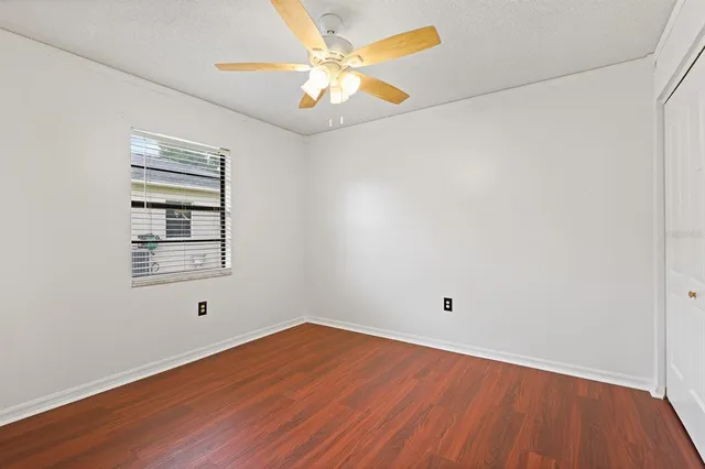 a building outdoor space with patio couches and pool