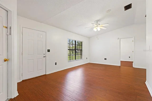 a view of an empty room with a window