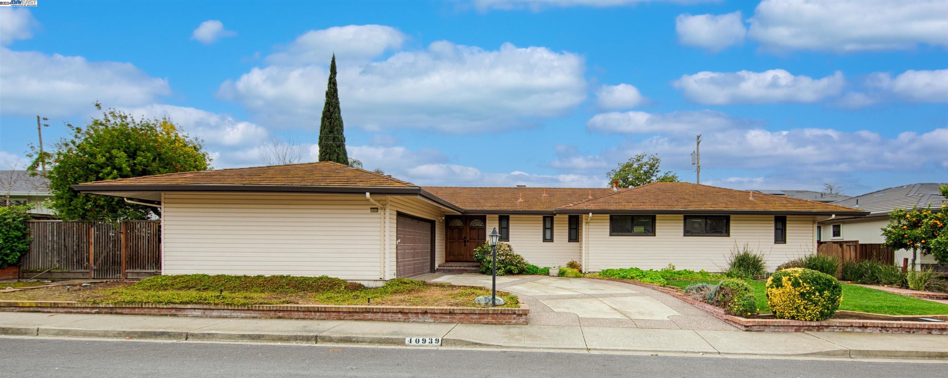 40939 Durillo Drive Fremont, CA 94539 - Photo 1 of 1 a front view of a house with garden