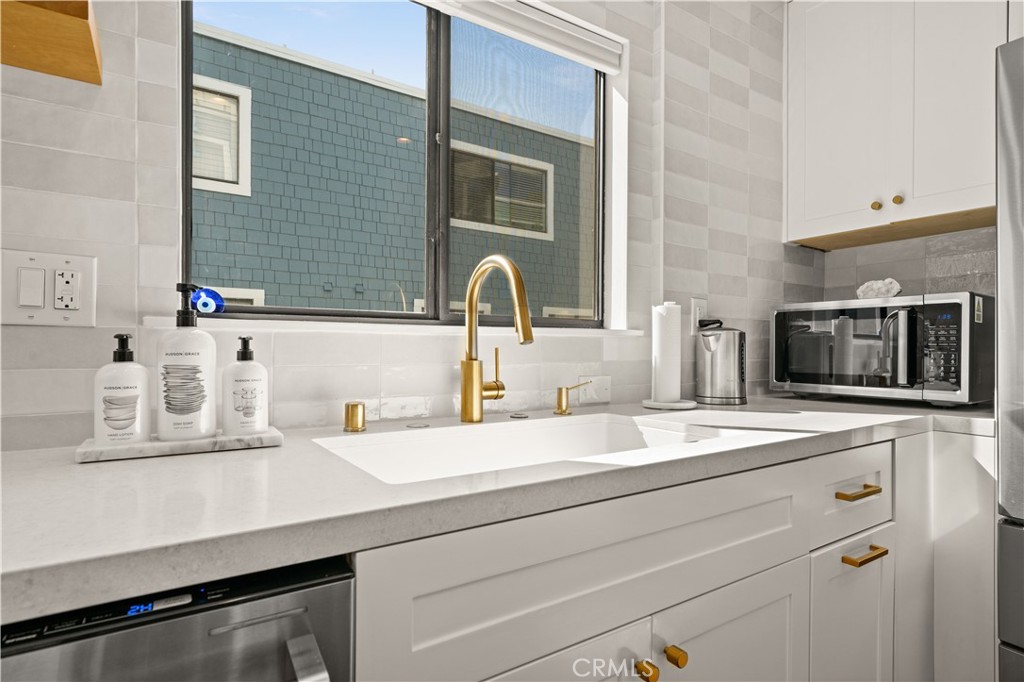 3716 Vía Dolce Marina del Rey, CA 90292 - Photo 19 of 55 a bathroom with a sink and a mirror