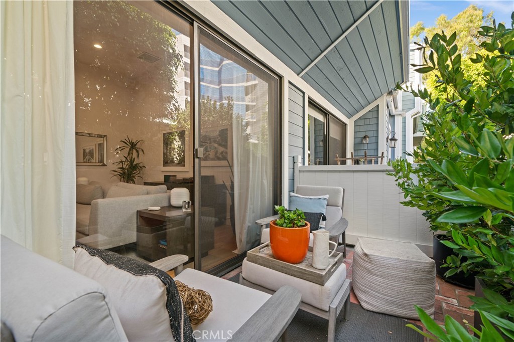 3716 Vía Dolce Marina del Rey, CA 90292 - Photo 39 of 55 a view of balcony with table and chairs potted plants