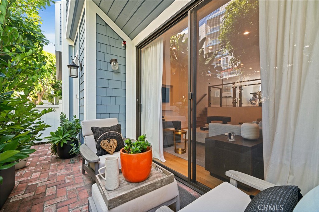 3716 Vía Dolce Marina del Rey, CA 90292 - Photo 40 of 55 a view of a balcony with chairs and a potted plant
