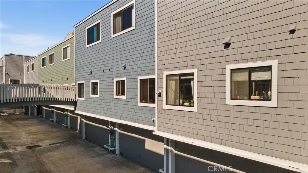 3716 Vía Dolce Marina del Rey, CA 90292 - Photo 52 of 55 a view of a house with a balcony and wooden fence