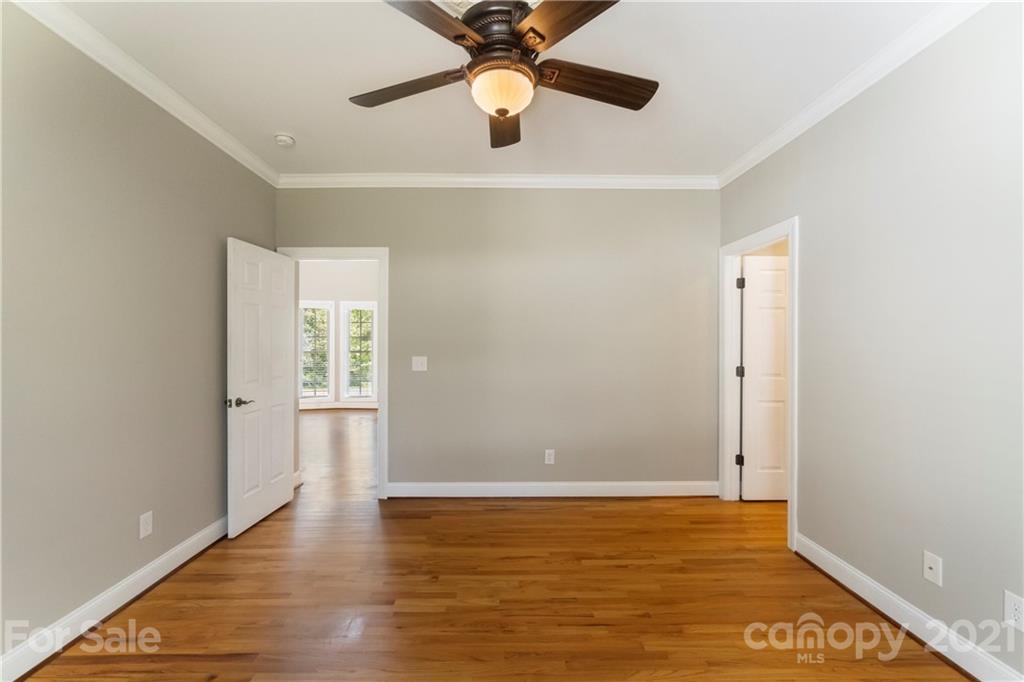 1466 Victorian Hills Circle Conover, NC 28613 - Photo 12 of 40 a view of an empty room with window and wooden floor