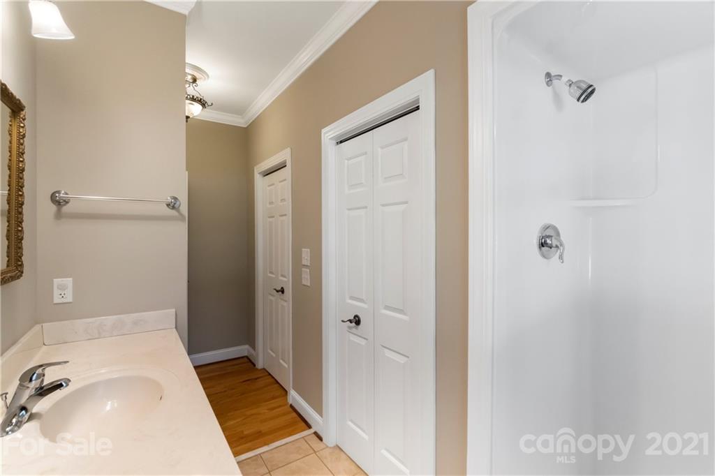 1466 Victorian Hills Circle Conover, NC 28613 - Photo 14 of 40 a bathroom with a sink and a tub