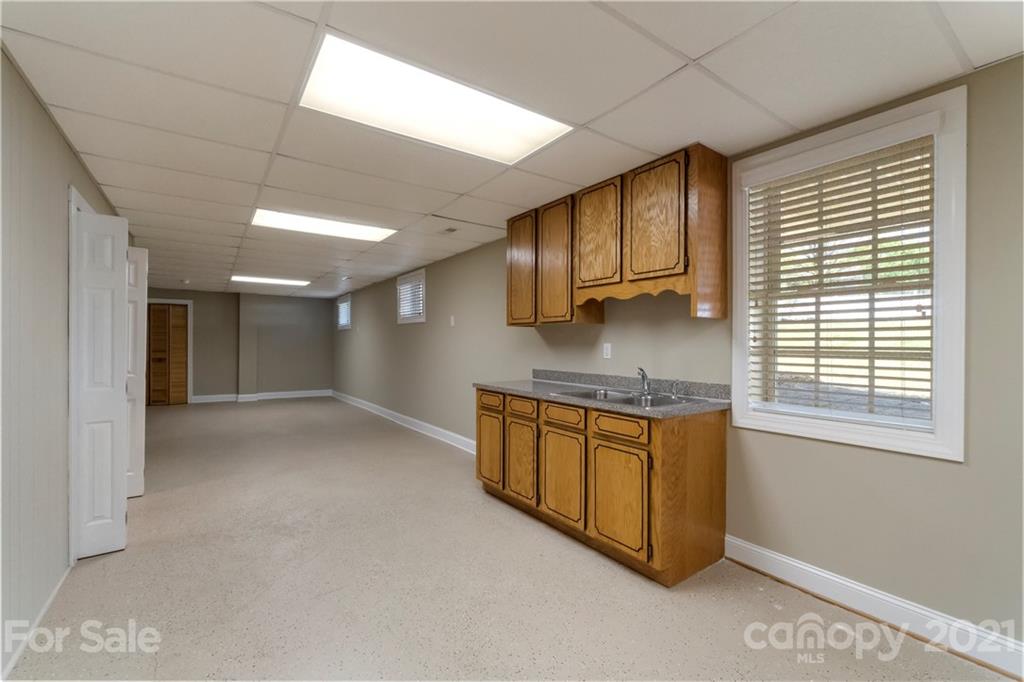 1466 Victorian Hills Circle Conover, NC 28613 - Photo 21 of 40 a kitchen with stainless steel appliances granite countertop a stove a sink and a refrigerator