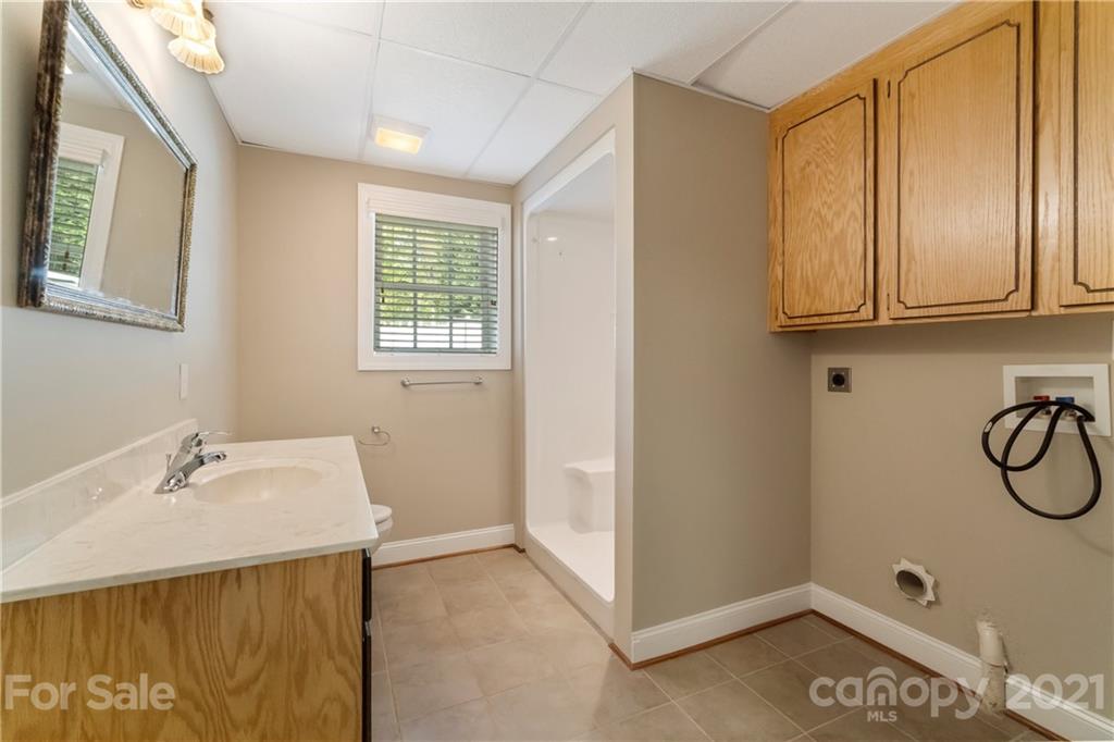 1466 Victorian Hills Circle Conover, NC 28613 - Photo 26 of 40 a bathroom with a sink and a window