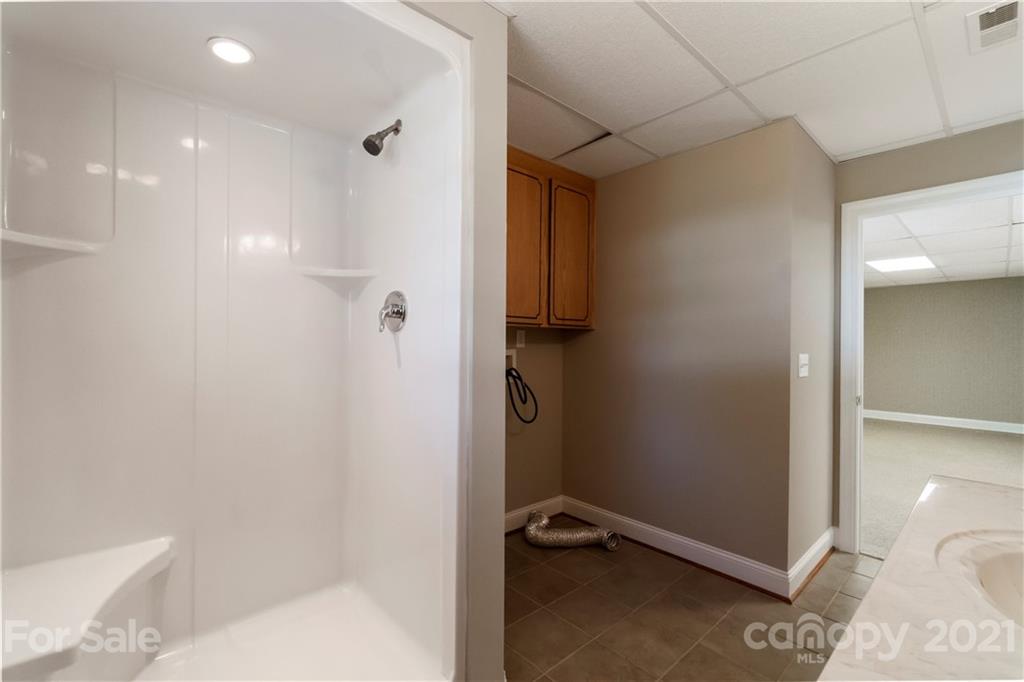 1466 Victorian Hills Circle Conover, NC 28613 - Photo 27 of 40 a bathroom with a shower and a toilet