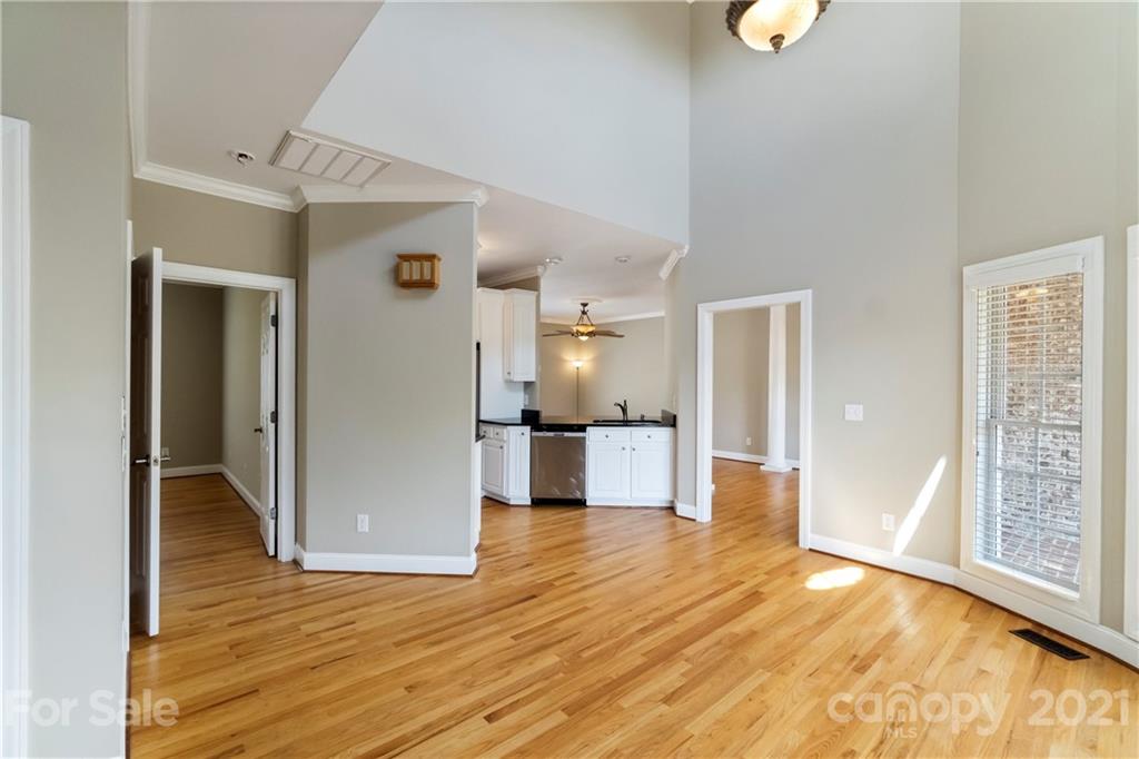 1466 Victorian Hills Circle Conover, NC 28613 - Photo 10 of 40 a view of a hallway with wooden floor and a living room