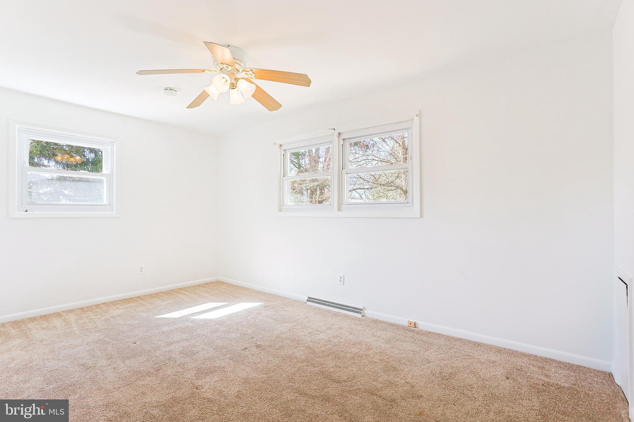 318 Exton Lane Exton, PA 19341 - Photo 14 of 41 an empty room with a window and a ceiling fan