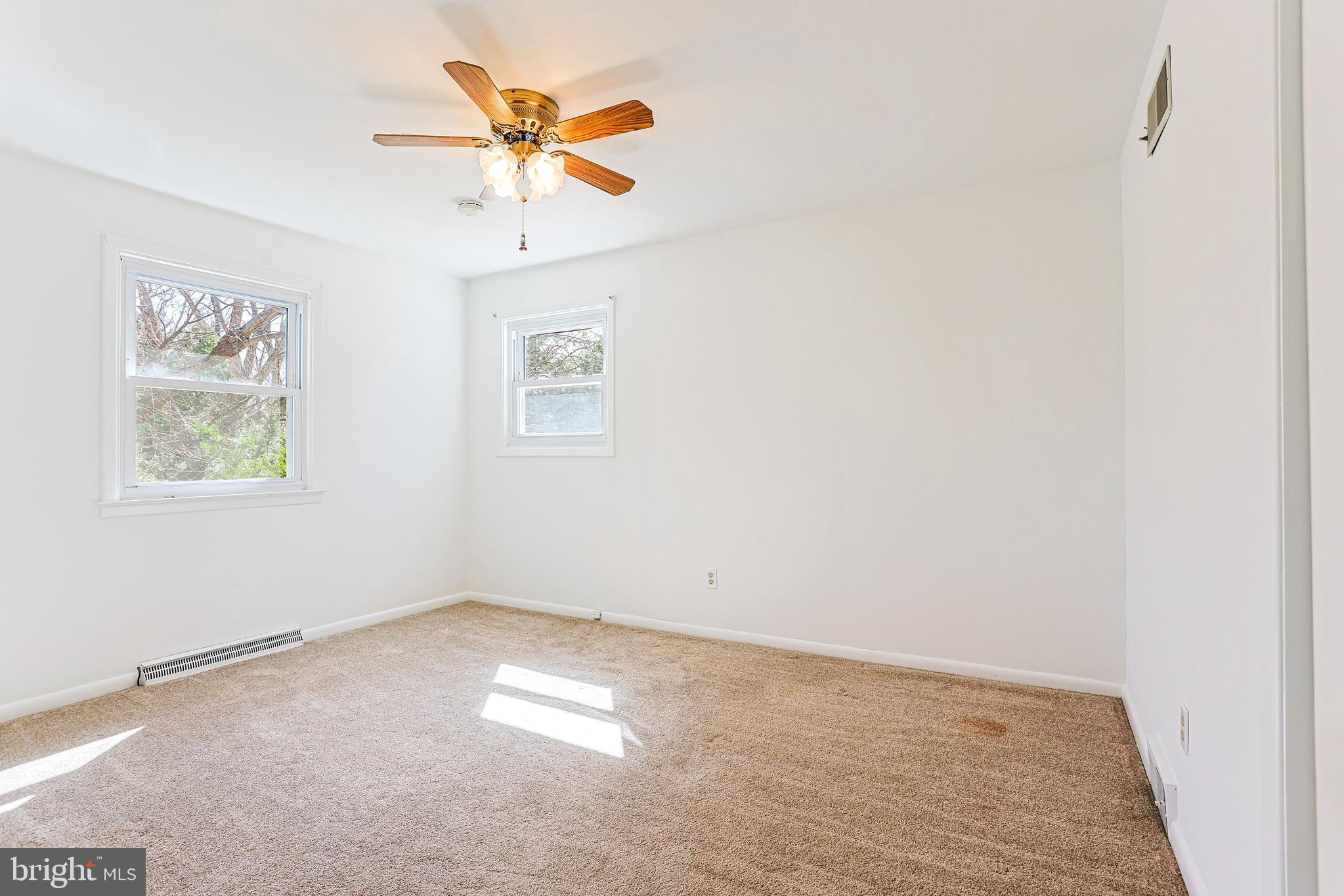 318 Exton Lane Exton, PA 19341 - Photo 18 of 41 an empty room with a window and a fan