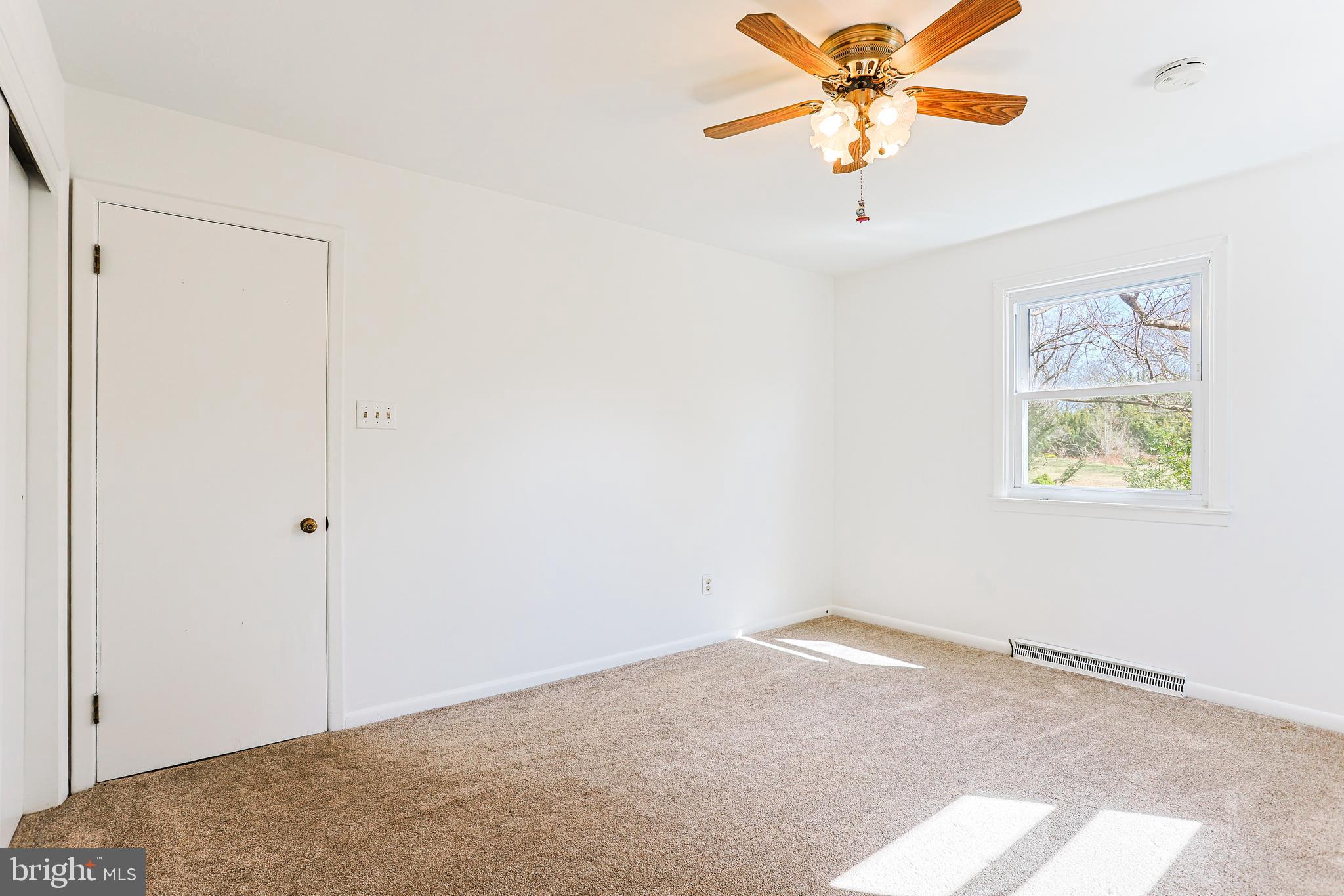 318 Exton Lane Exton, PA 19341 - Photo 20 of 41 a view of a room with a ceiling fan and a window