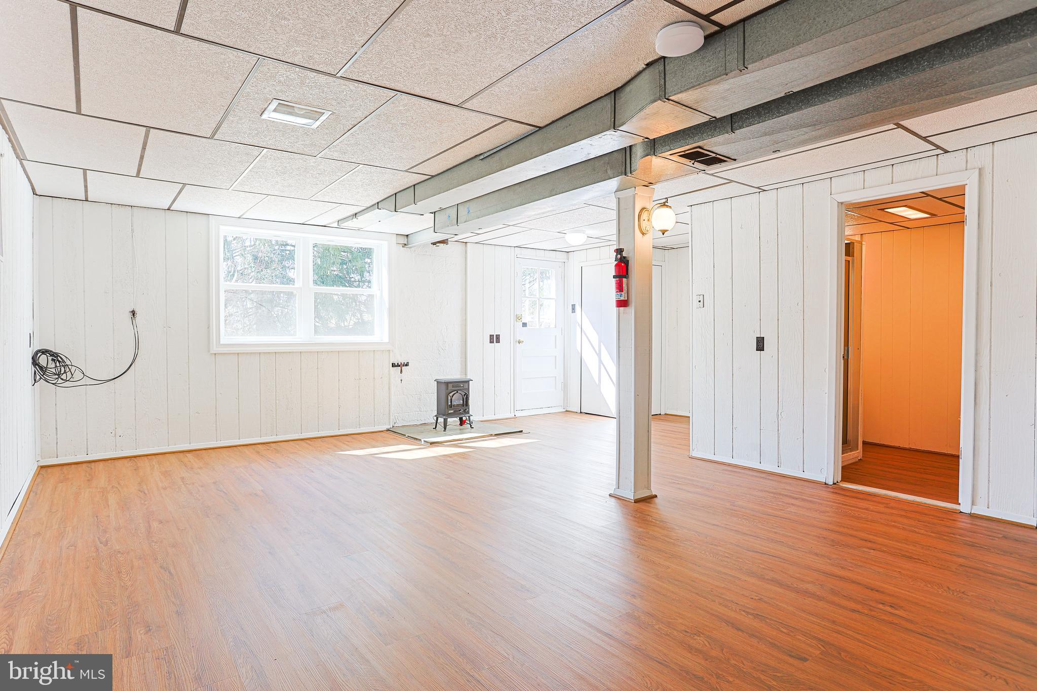 318 Exton Lane Exton, PA 19341 - Photo 24 of 41 a view of empty room with wooden floor and windows