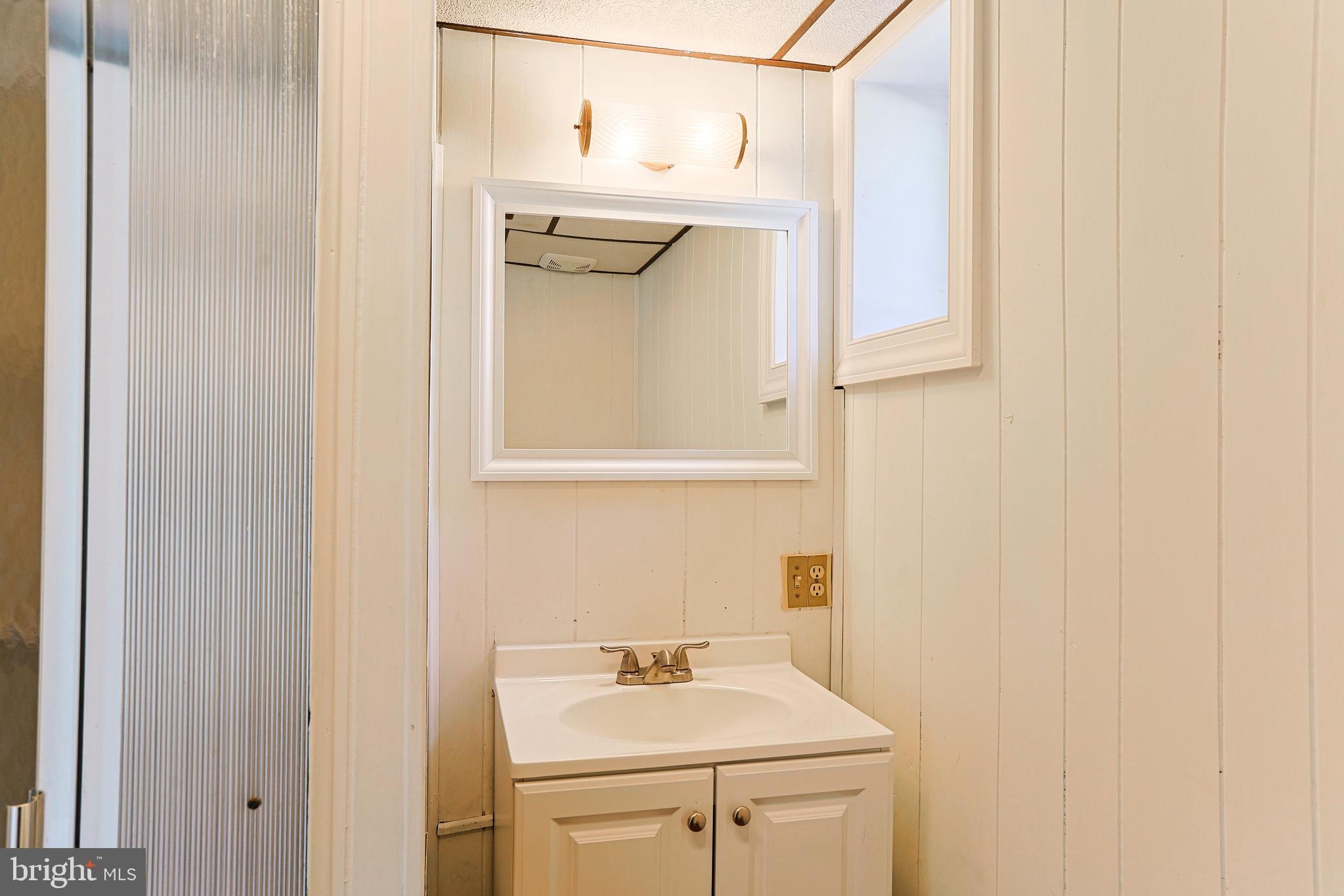 318 Exton Lane Exton, PA 19341 - Photo 27 of 41 a bathroom with a sink a mirror and shower