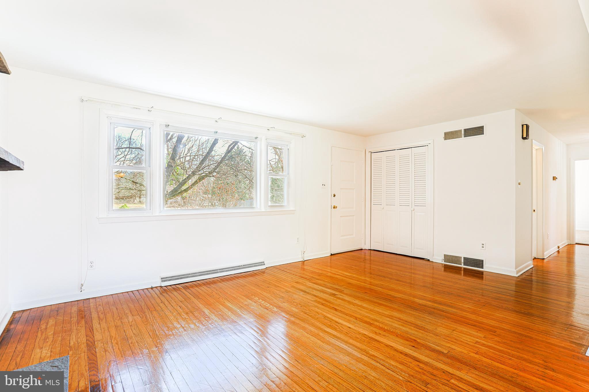 318 Exton Lane Exton, PA 19341 - Photo 5 of 41 a view of empty room with wooden floor and fan