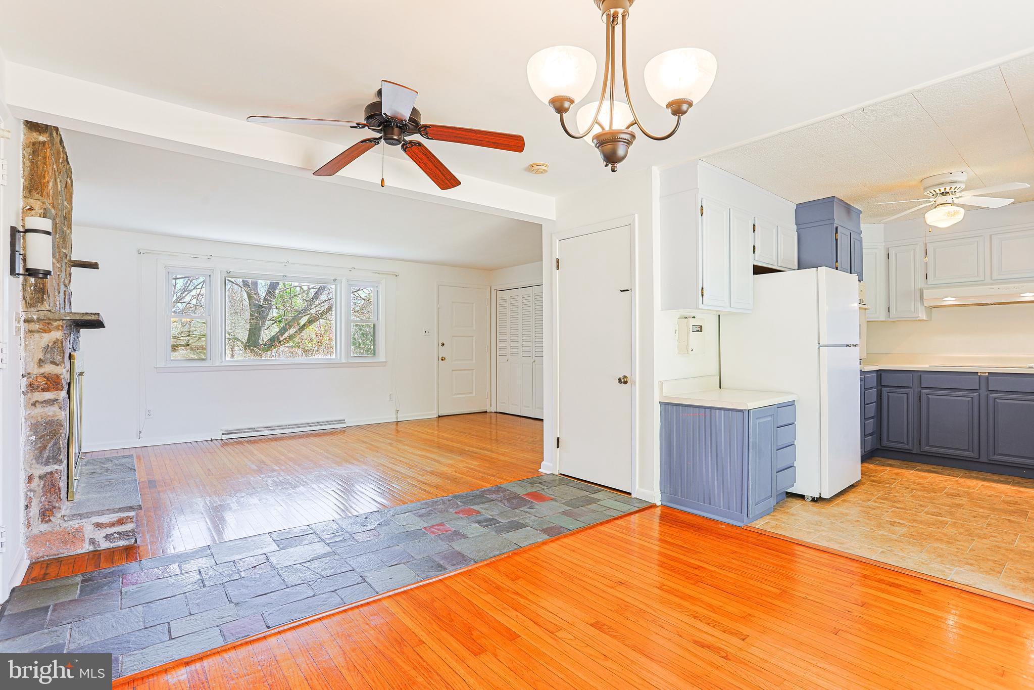 318 Exton Lane Exton, PA 19341 - Photo 8 of 41 a bedroom with a large bed a chandelier and dresser