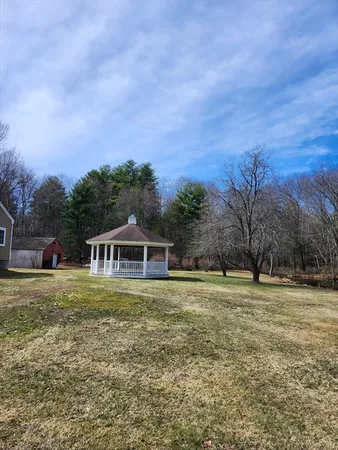 a view of a house with a big yard