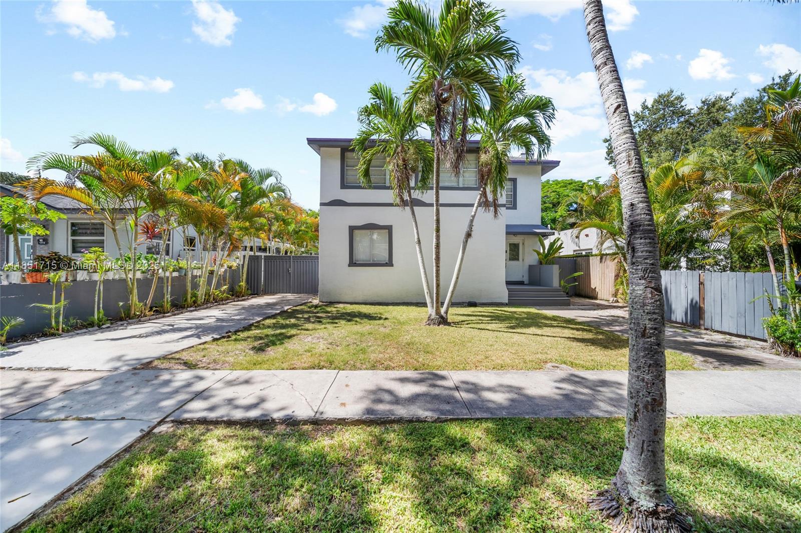 1520 Southwest 11th Terrace, Unit B Miami, FL 33135 - Photo 1 of 32 a view of house with palm trees