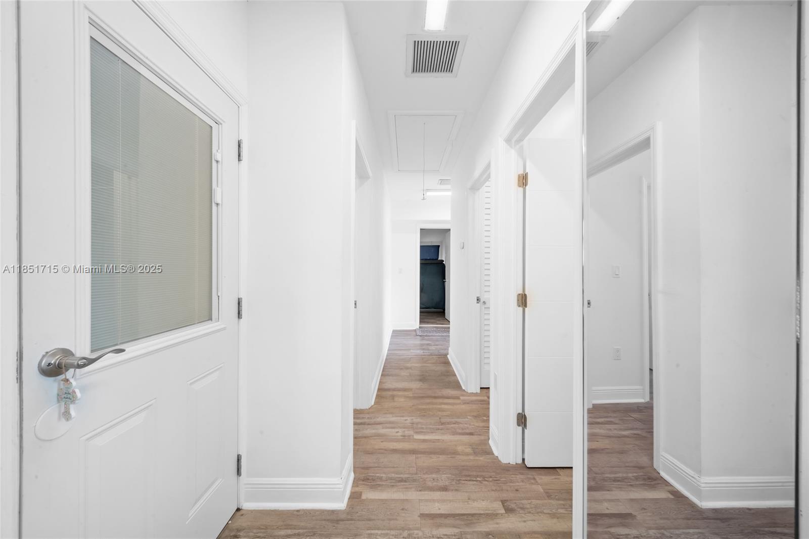 1520 Southwest 11th Terrace, Unit B Miami, FL 33135 - Photo 12 of 32 a view of a hallway with wooden floor and staircase