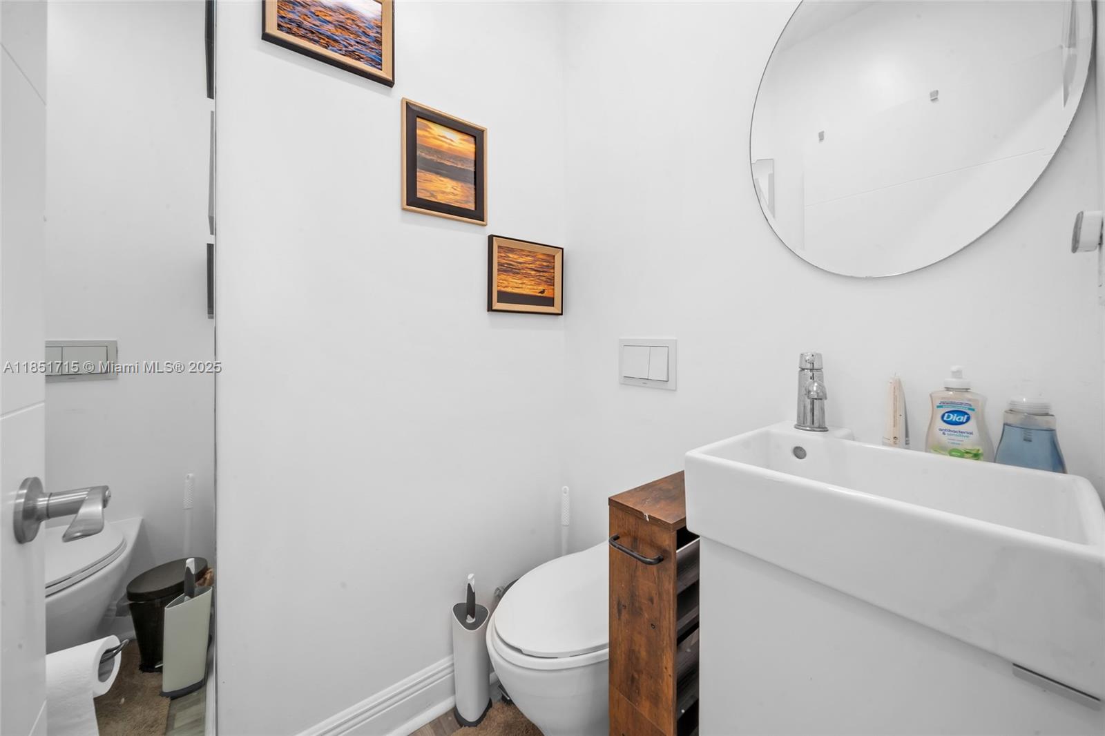 1520 Southwest 11th Terrace, Unit B Miami, FL 33135 - Photo 17 of 32 a bathroom with a sink a toilet and a mirror