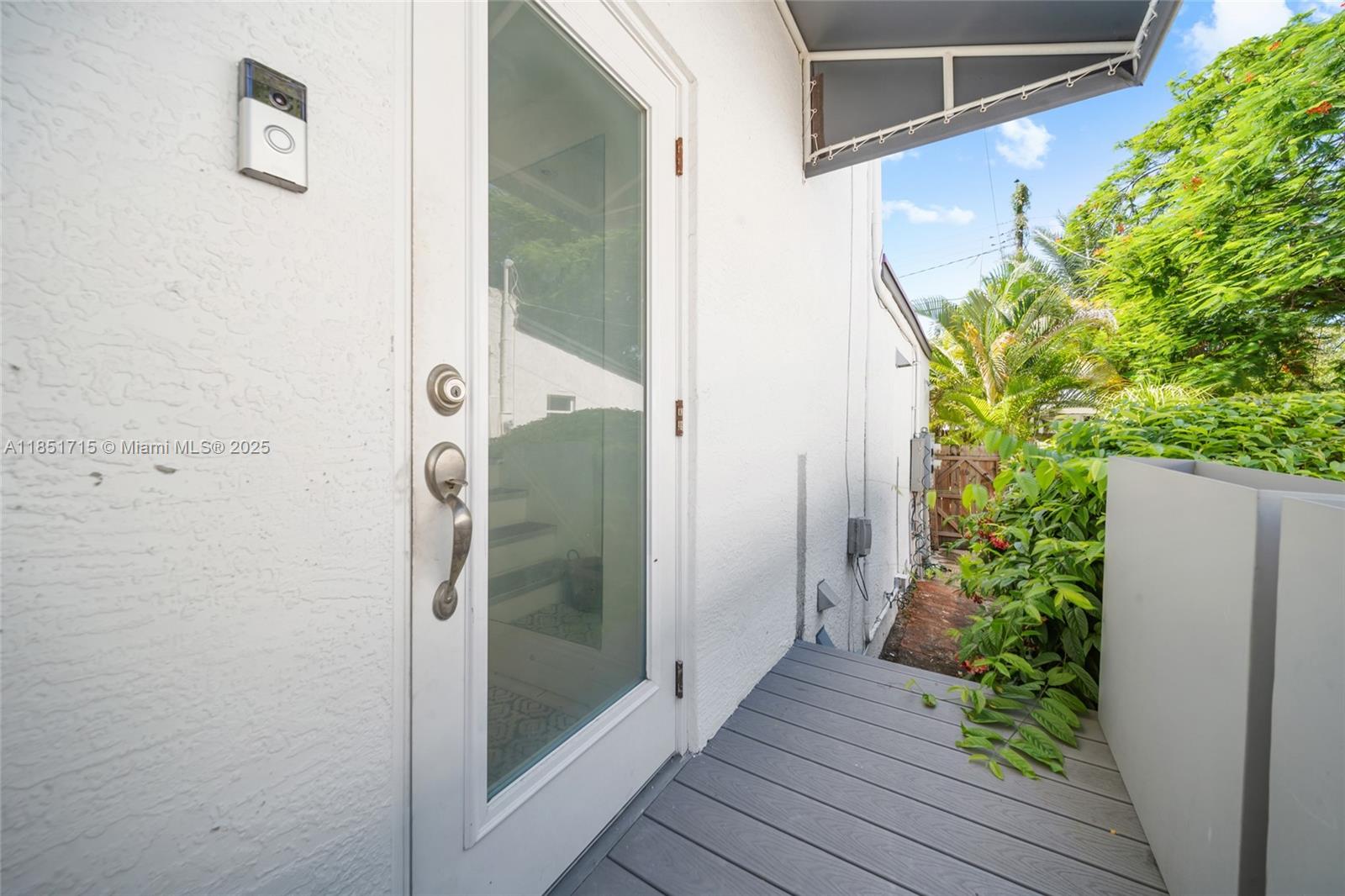 1520 Southwest 11th Terrace, Unit B Miami, FL 33135 - Photo 25 of 32 a bathroom with a glass shower door and mirror