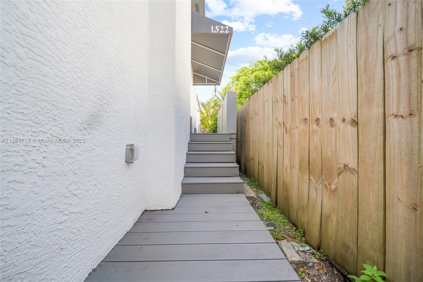 1520 Southwest 11th Terrace, Unit B Miami, FL 33135 - Photo 30 of 32 a view of a pathway with a white door