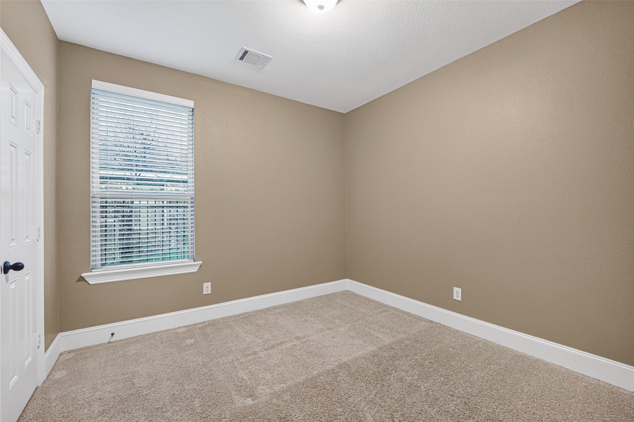 7930 Summer Night Lane Rosenberg, TX 77469 - Photo 26 of 48 Comfortable secondary bedroom featuring a large window, neutral finishes, and ample closet space.