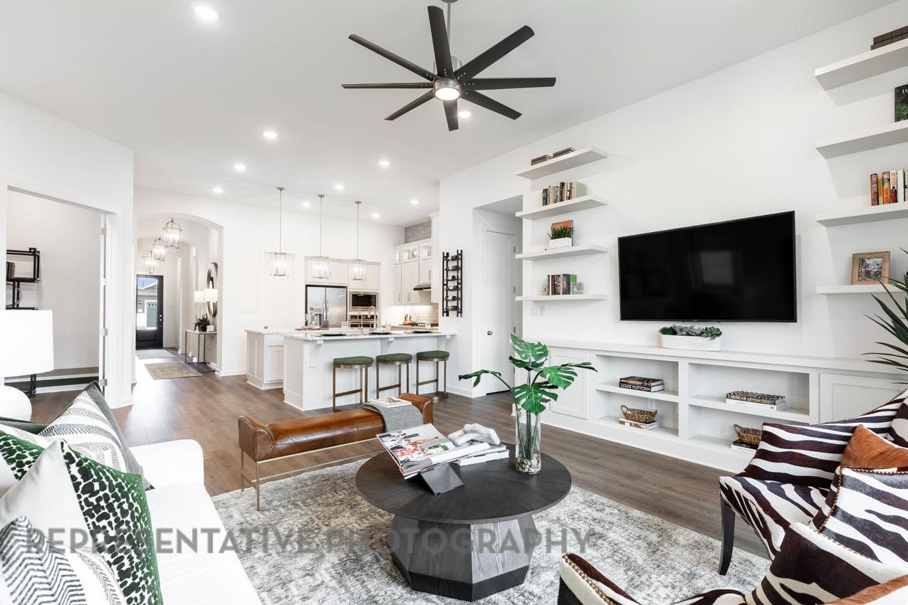 2714 Peach Vly Road Fulshear, TX 77423 - Photo 14 of 47 a living room with furniture and a flat screen tv