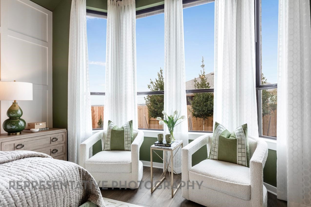 2714 Peach Vly Road Fulshear, TX 77423 - Photo 18 of 47 a bedroom with a balcony a bed and a couch