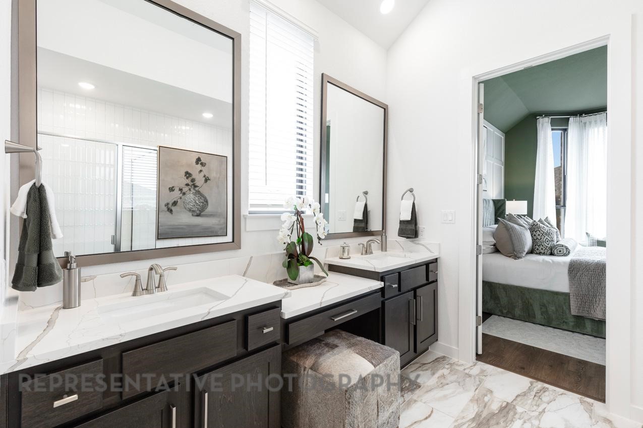 2714 Peach Vly Road Fulshear, TX 77423 - Photo 19 of 47 a en suite bathroom with a granite countertop sink and a mirror