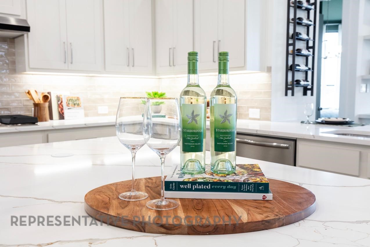 2714 Peach Vly Road Fulshear, TX 77423 - Photo 4 of 47 a view of a kitchen with kitchen island stainless steel appliances a sink and a counter top
