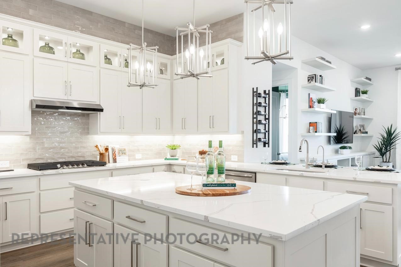 2714 Peach Vly Road Fulshear, TX 77423 - Photo 8 of 47 a kitchen with cabinets a sink and appliances