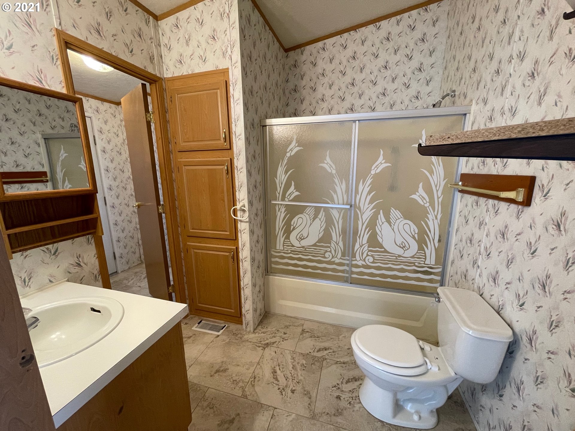 2150 Laura Street, Unit 61 Springfield, OR 97477 - Photo 18 of 24 a bathroom with a sink toilet and shower