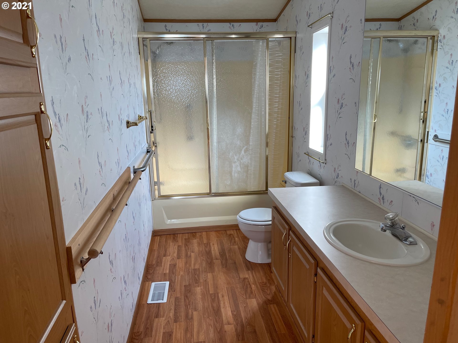 2150 Laura Street, Unit 61 Springfield, OR 97477 - Photo 22 of 24 a bathroom with a sink a toilet and shower