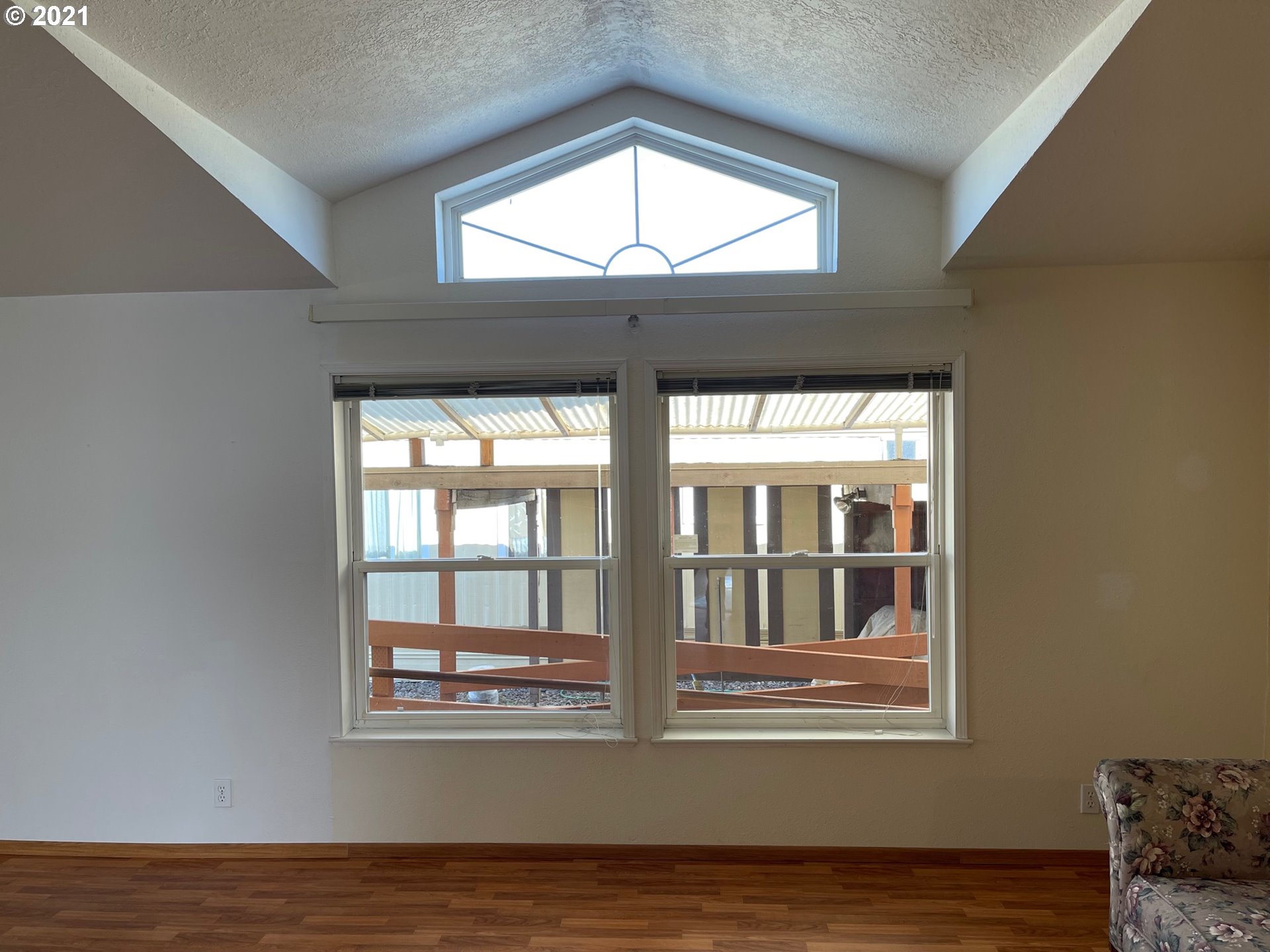 2150 Laura Street, Unit 61 Springfield, OR 97477 - Photo 24 of 24 a view of empty room with wooden floor and fan