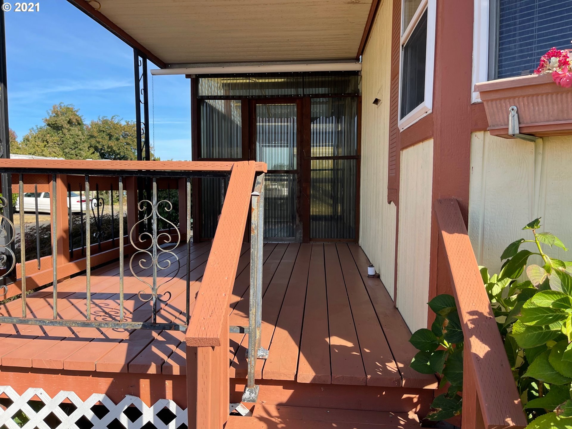 2150 Laura Street, Unit 61 Springfield, OR 97477 - Photo 7 of 24 a view of balcony with wooden floor and seating space