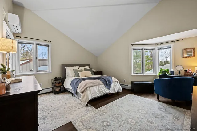 a bed room with a bed and a window