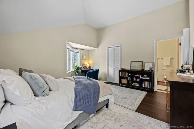 a bed room with a bed window and a couch