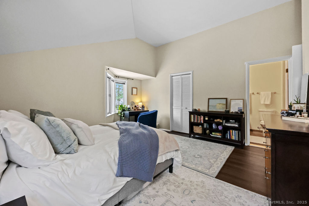 9 Talcott Ridge Road, Unit A4 Farmington, CT 06032 - Photo 16 of 28 a bed room with a bed window and a couch