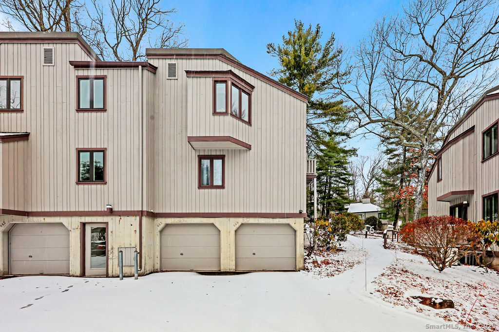 9 Talcott Ridge Road, Unit A4 Farmington, CT 06032 - Photo 21 of 28 a white house that has a tree on the side of it