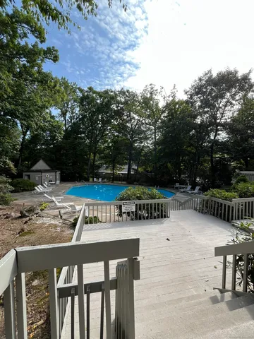 a view of backyard with a table and chairs